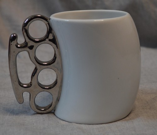 Brass knuckles shaped white - brass,
