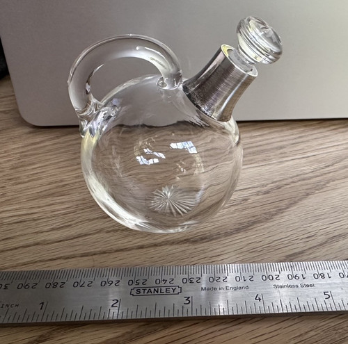 Glass decanter with silver
