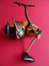 A GOOD USED VINTAGE/RETRO OLYMPIC 8500 SPINNING REEL