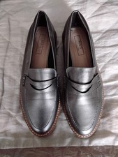 LADIES NWOT SILVER FLAT SHOES FROM MARKS AND SPENCER IN A SIZE 5