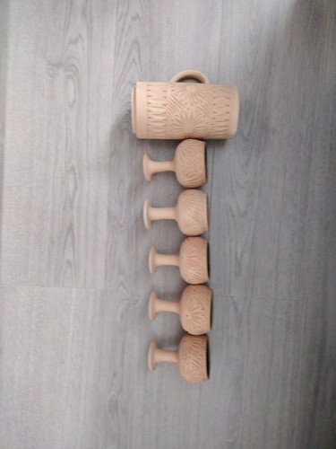 Clay jug and five - and, cups