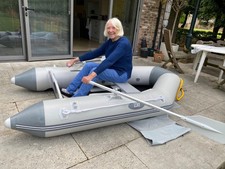 inflatable boat with solid floor, seat & transom, paddles etc