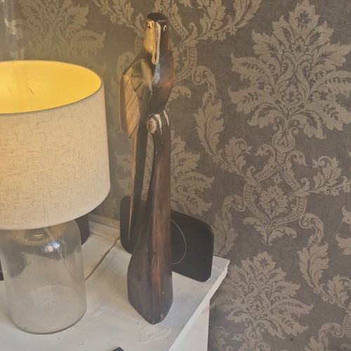 Hand carved wooden parrot bird - hand,
