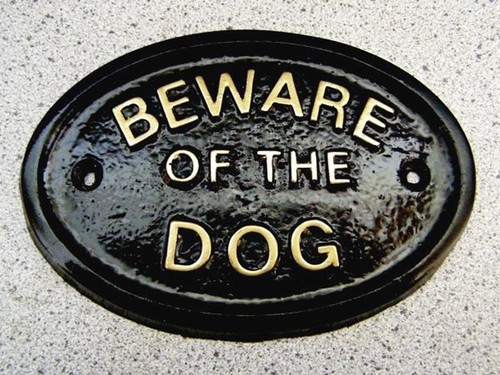Beware the dog dogs - of, or