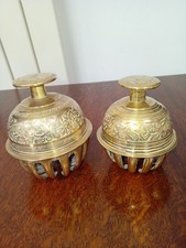 Two vintage brass claw bells. Etched flower/leaf design. 9cm & 7.5cm high