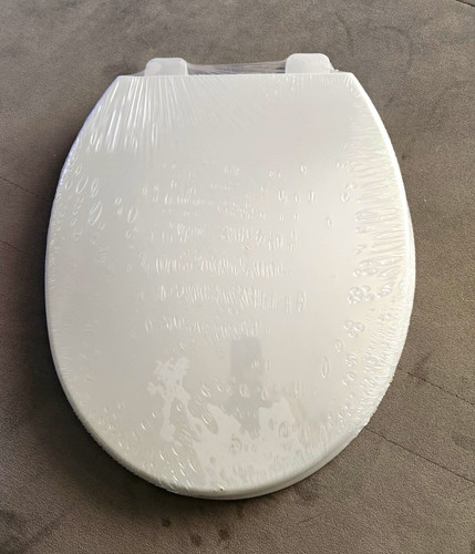 Grey oval plastic toilet - toilet, seat