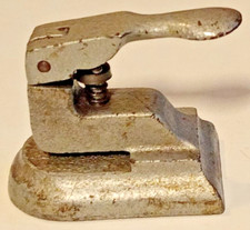 Vintage Paper Punch single hole cast metal 3 inches tall 3.5 inches long