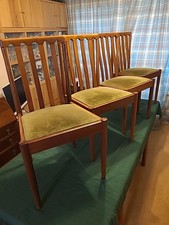 Meredew, A Set of Four Mid Century Teak Dining Chairs With Upholstered Seats 