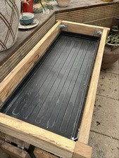 Patio plant stand made with reclaimed oak and complete with a grow bag tray