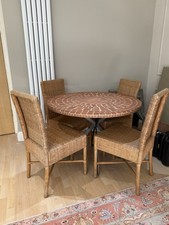 Round mosaic dining table with 4 wicker chairs