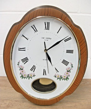 Contemporary Wm. Widdop Quartz Movement Wall Clock with Pendulum. Untested.