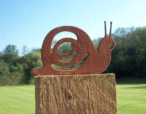 Rusty metal snail - rusty, garden