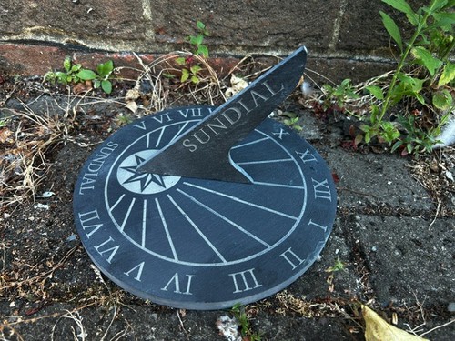 Imperfect round slate sundial - slate,
