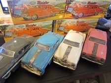 4 Minister De Luxe tinplate friction drive cars based on Pontiac Chieftain