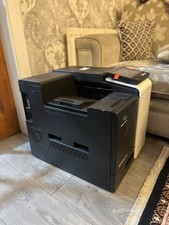 The product in the image is a Konica Minolta bizhub 4700i printer.