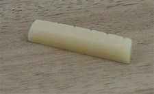 Vintage unbleached bone guitar