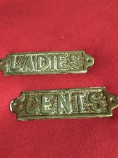 Brass toilet sign
