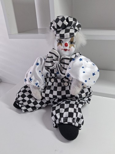 Porcelain clown doll with - porcelain, sand