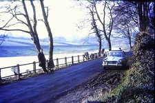Photographic slide of classic Triumph Herald Car down lane amateur photography 