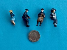 Four Edwardian style figures