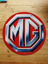 MG LOGO 14" ROUND METAL SIGN/