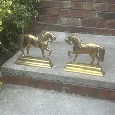 A fine pair Of heavy brass door stops Iron of horse form Circus -One With Damage