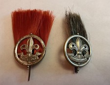 Two Vintage Boy Scout Red Plume and Grey/Green Cap Badges