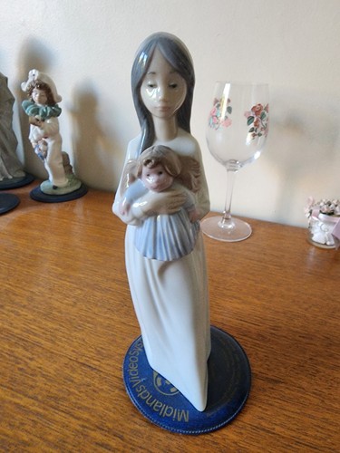 Nao girl holding doll - holding,