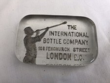 Collectors Glass advertising Block Paperweight The International Bottle Company