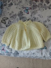hand knitted matinee coat in lemon