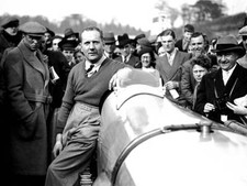 John Cobb leans on his car