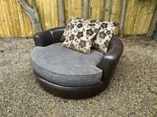 Modern cuddle snuggle chair brown leather & fabric swivel lounge