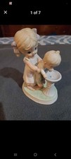 Girl helping little boy - little,