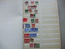 A PART FILLED STOCKBOOK/ALBUM