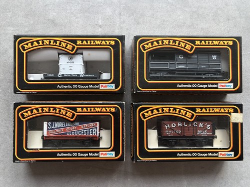 Four boxed mainline wagons - four,