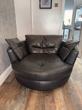 DFS leather Cuddle Swivel Arm