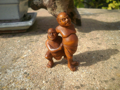 Hand carved wood - hand, sumo