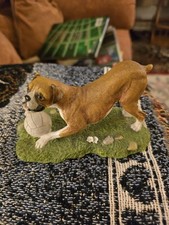 boxer dog ornament playing with ball