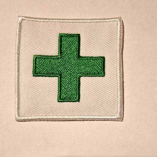 First aid cross green - first,