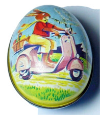 RARE FIGURAL EGG CHOCOLATE/SWEETS TIN RABBIT ON A PINK VESPA SCOOTER 