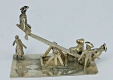 Dutch silver miniature toy group of men on a seesaw in Tricorn hats