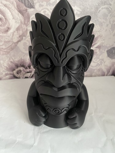 Tiki head sculpture garden - tiki,