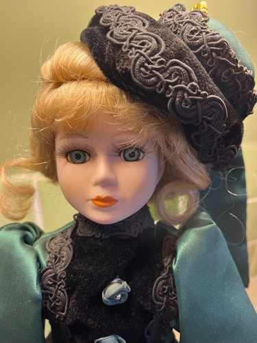 Porcelain doll dressed in - doll,