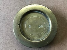 old brass 8 oz weight . nice