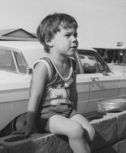 1960s boy sitting wall car - boy,