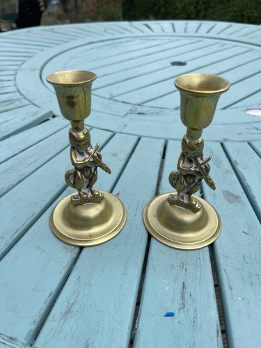 Two brass candlesticks - two,