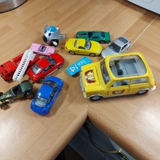 Selection of toy cars including a mini, blue beetle, fire engine, nissan...