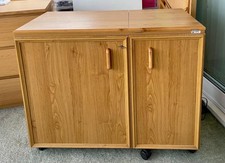 Horn sewing machine cabinet