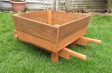 wooden wheelbarrow planter