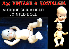 ANTIQUE PORCELAIN HEAD CHINA BABY DOLL; MOVING LIMBS 400mm TALL; FOR RESTORATION